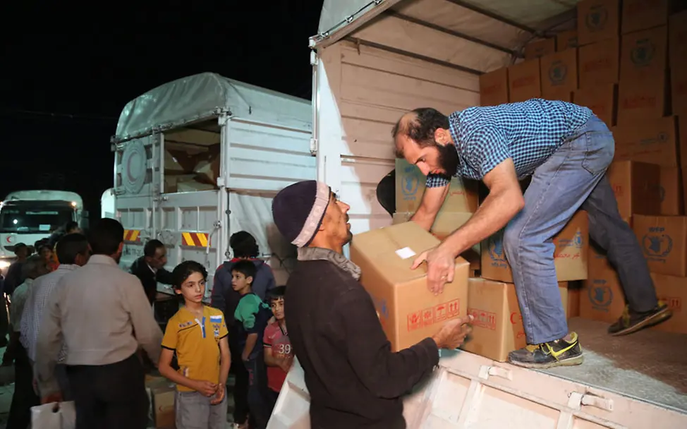 Hilfsgüter erreichen Syrien: Helfer entladen die lebensrettenden Lieferungen | © UNICEF/Al Saleh Hilfsgüter erreichen Syrien: Helfer entladen die lebensrettenden Lieferungen