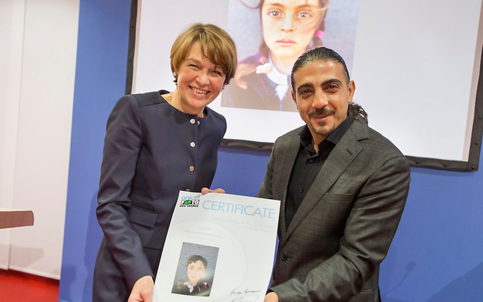 Photo journalist Muhammed Muheisen together with Elke Büdenbender