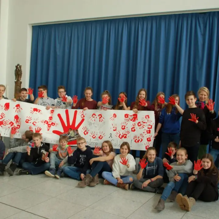 red hands banner Mariengymnasium red hands banner Mariengymnasium