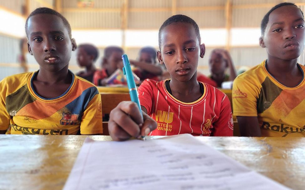 Somalia: Adan (Mitte) musste aus seiner Heimat fliehen.