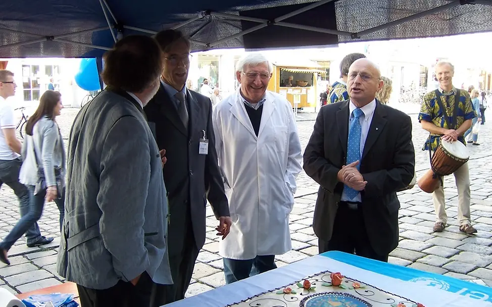 Vier Herren im Gespräch © UNICEF-AG Landshut