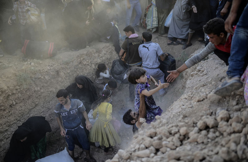 Syrian-Turkish border: Through barbed wire | © Bülent Kiliç/AFP